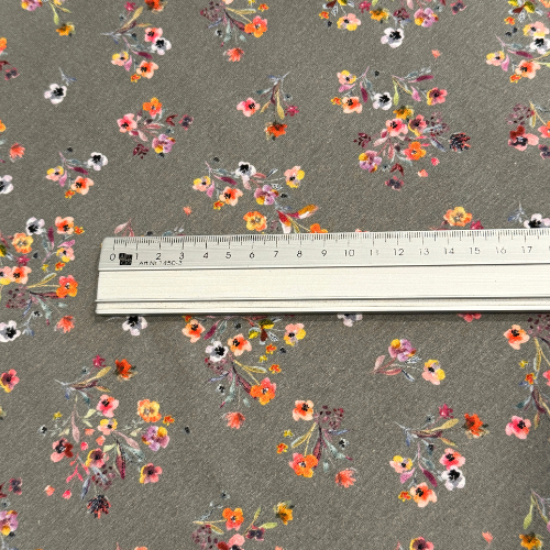Baumwolljersey in grau mit Streublumen