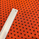 Baumwolljersey Rost mit schwarzen Sternen