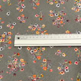 Baumwolljersey in grau mit Streublumen