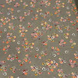 Baumwolljersey in grau mit Streublumen