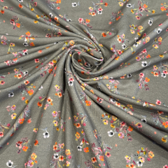 Baumwolljersey in grau mit Streublumen